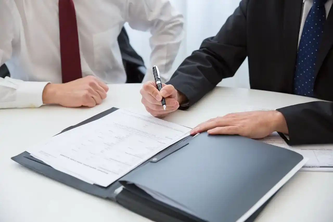 Precision in Every Transition - Professional hands signing an important document with an elegant fountain pen, with perhaps a watch visible to convey seniority and sophistication